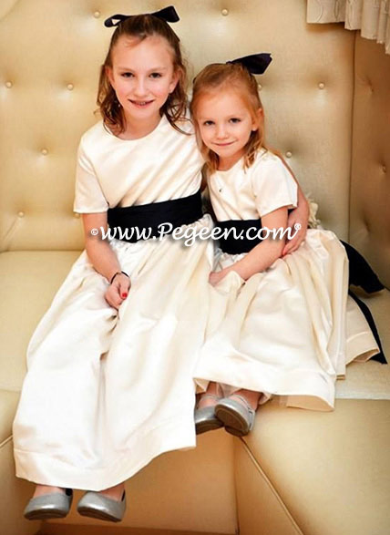 Flower girl dresses style 383 in imported ivory satin with navy silk bustles