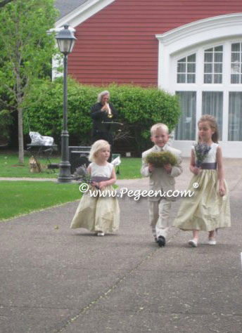 Flower girl dresses with matching doll in spring green and euro lilac.